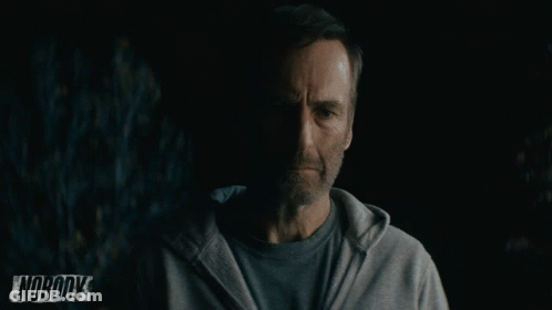 Man In Grey Hoodie Standing In Front Of Nobody Sign GIF