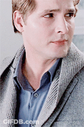 Man In Grey Jacket And Blue Shirt Close Up GIF