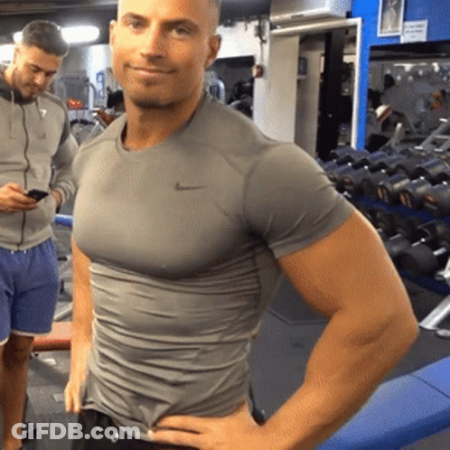 Man In Grey Nike Shirt Standing In Gym GIF