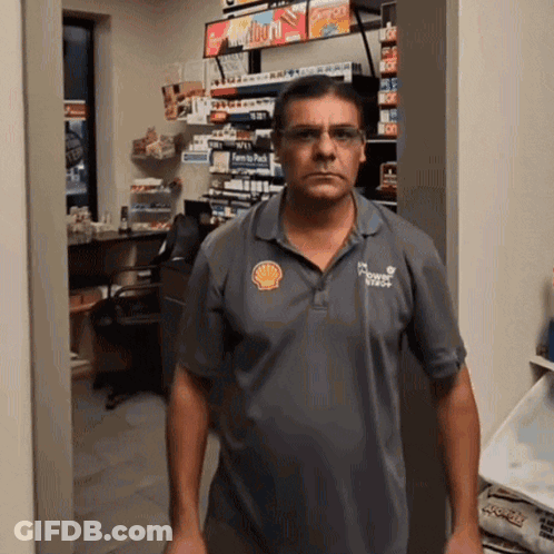 Man In Grey Shell Logo Shirt GIF