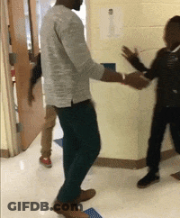 Man In Grey Shirt Dancing With Boy In Black GIF