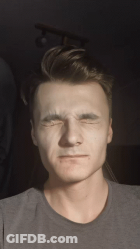 Man In Grey Shirt Making Funny Face GIF