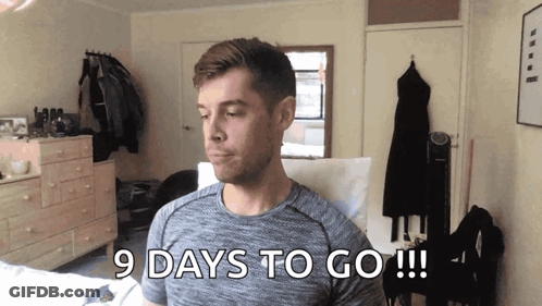 Man In Grey Shirt Says 9 Days To Go GIF