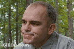 Man In Grey Shirt Smiling Eyes Closed In Woods GIF