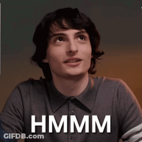 Man In Grey Shirt Smiling Hmm GIF
