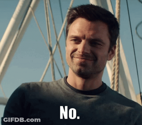 Man In Grey Shirt Smiling Saying No GIF
