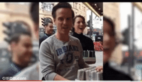 Man In Grey Shirt With Irsland GIF