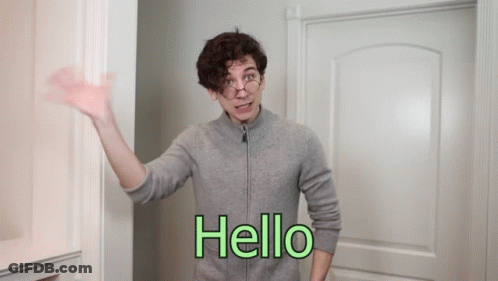 Man In Grey Sweater Saying Hello GIF
