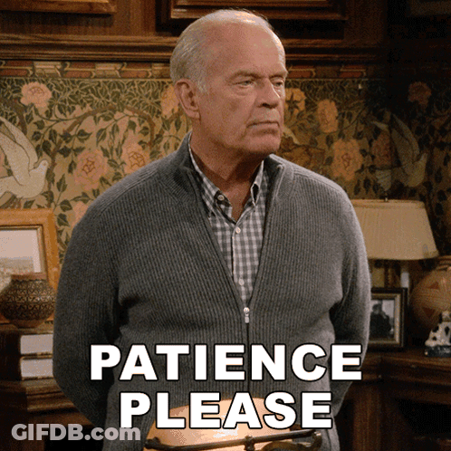 Man In Grey Sweater Saying Patience Please GIF