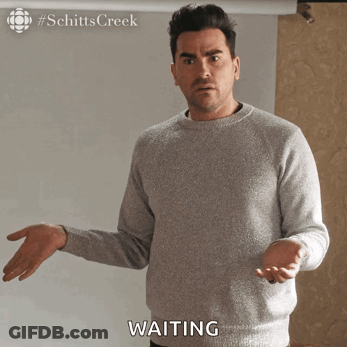 Man In Grey Sweater Waiting GIF
