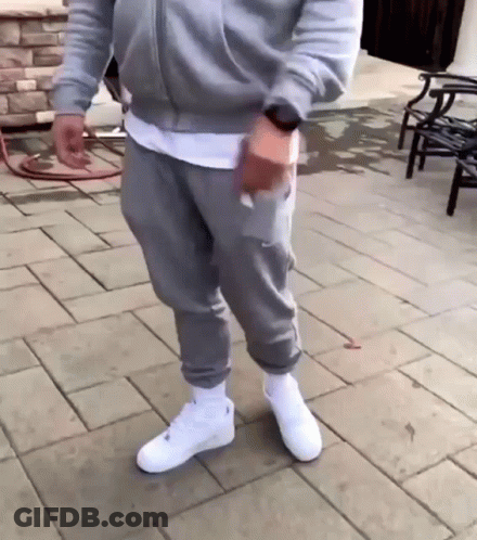 Man In Grey Sweatpants And White Nike Air Force 1 GIF