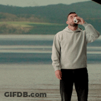 Man In Grey Sweatshirt Drinking From Can GIF