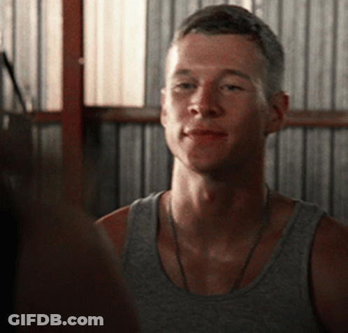 Man In Grey Tank Top Looks At Another GIF