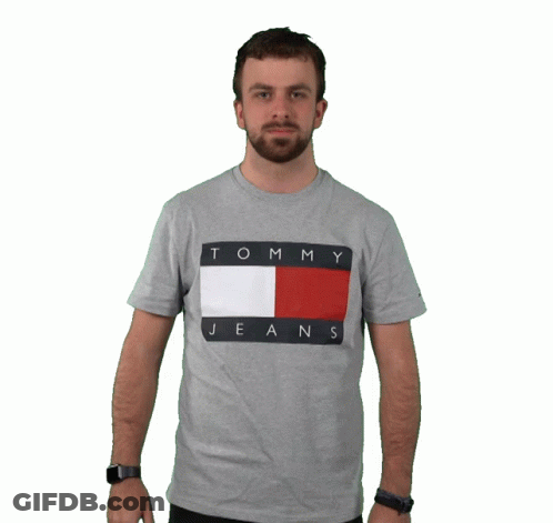 Man In Grey Tommy Hilfiger Shirt Holding It Up GIF