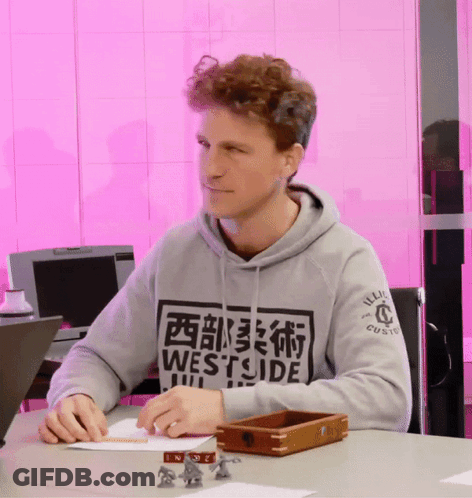 Man In Grey Westside Sweatshirt At Desk GIF
