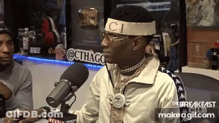 Man In Gucci Headband Sitting At Microphone GIF