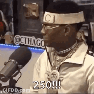 Man In Gucci Headband Talking Into Microphone GIF