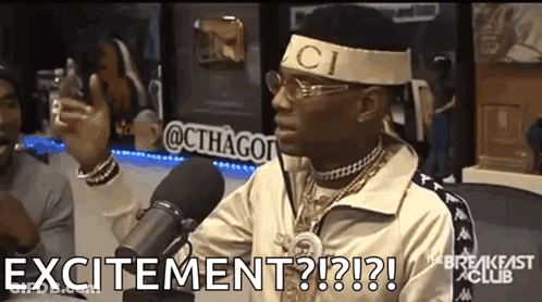 Man In Gucci Headband Talking Into Microphone Holding Cell Phone GIF