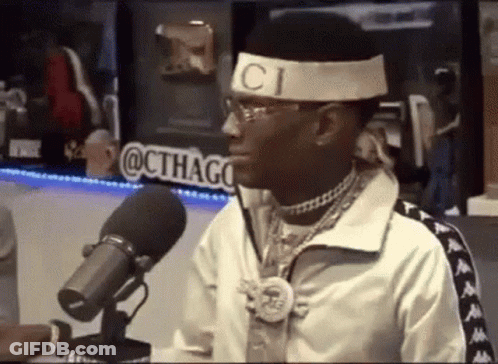 Man In Gucci Headband Talking Into Microphone GIF