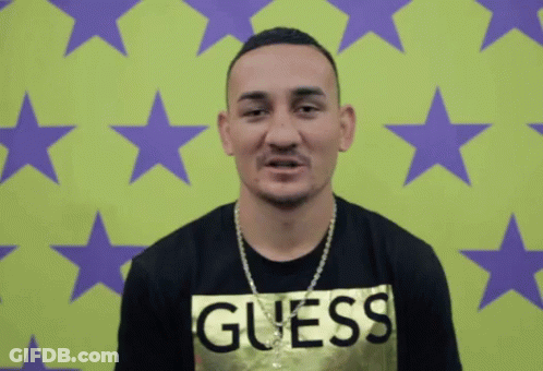 Man In Guess Shirt With Green Purple Background GIF