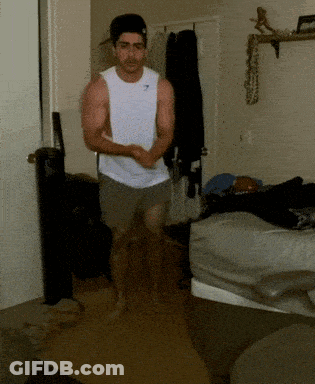 Man In Gymshark Tank Top Running In Room GIF