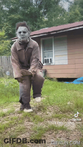 Man In Halloween Costume In Front Of House GIF