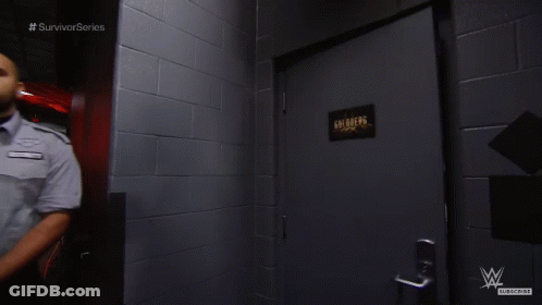 Man In Hallway With Survivor Series Text GIF