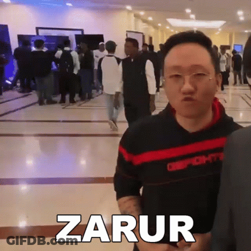 Man In Hallway With Zarur On Floor GIF