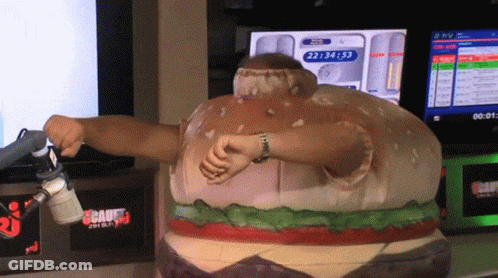 Man In Hamburger Costume In Front Of Screen Showing 22:44:53 GIF