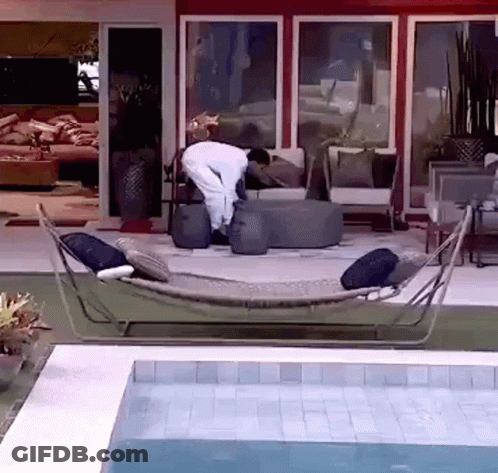 Man In Hammock By Pool GIF