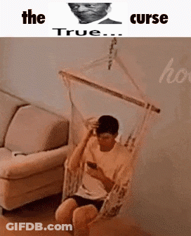Man In Hammock In Living Room On Phone GIF