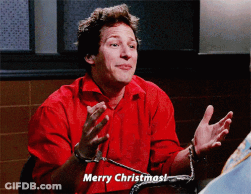 Man In Handcuffs Says Merry Christmas In Red Shirt GIF
