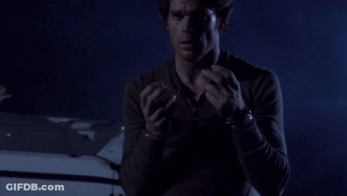 Man In Handcuffs Standing By Car GIF