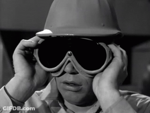 Man In Hard Hat Covering Ears GIF