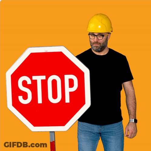 Man In Hard Hat Holding Stop Sign GIF