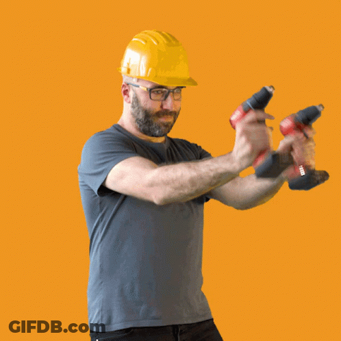 Man In Hard Hat Holding Two Hilti Tools GIF