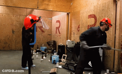 Man In Hard Hat In Front Of Wall With R And G GIF
