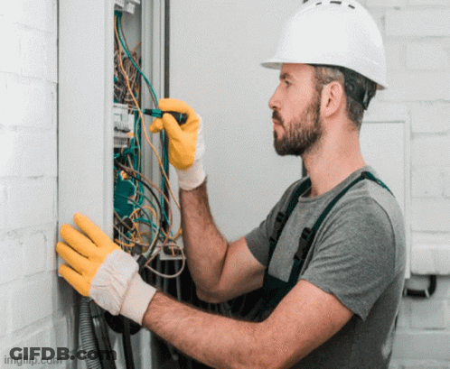 Man In Hard Hat Working On Electrical Box GIF