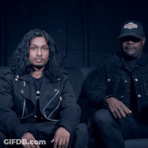 Man In Harley Davidson Hat Beside Man In Black Jacket GIF
