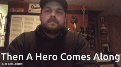 Man In Hat And Black Hoodie Saying Then A Hero Comes Along GIF