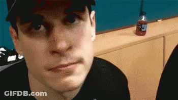 Man In Hat And Black Shirt Making Face GIF