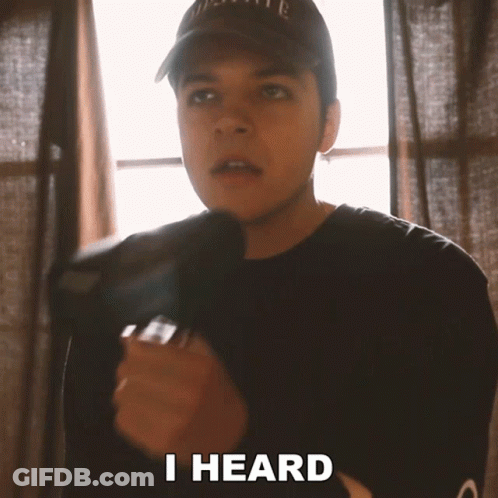Man In Hat And Black Shirt Saying I Heard GIF
