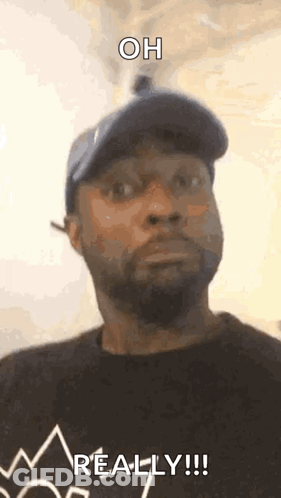 Man In Hat And Black Shirt Saying Oh Really GIF