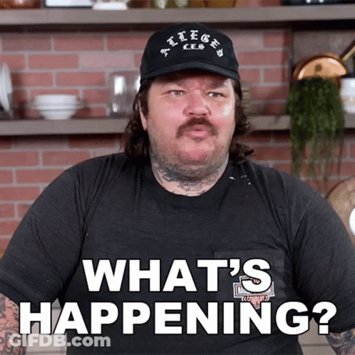 Man In Hat And Black Shirt Says What's Happening GIF