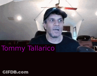 Man In Hat And Black Shirt With Tommy Tallarico Name GIF