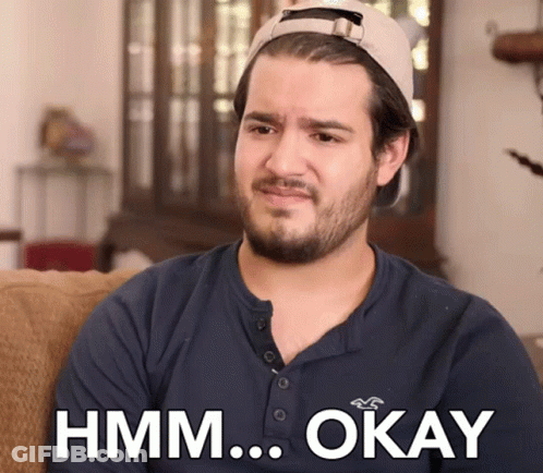 Man In Hat And Blue Shirt Saying Hmm Okay GIF