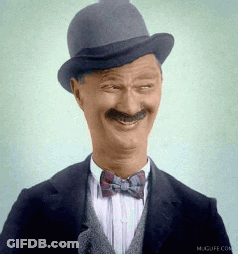 Man In Hat And Bow Tie Smiling GIF