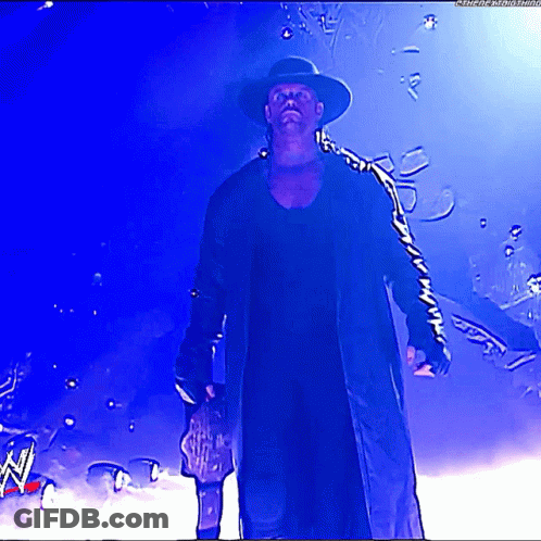 Man In Hat And Coat Holding Trophy GIF