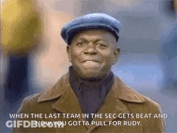 Man In Hat And Coat Smiling And Talking GIF