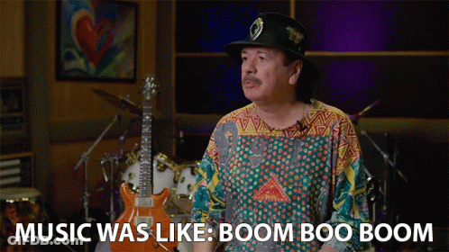Man In Hat And Colorful Shirt Says Music Was Like Boom Boo Boom GIF